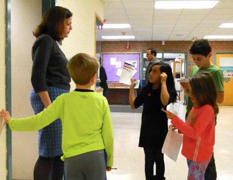 Cunniff Kids News reporters interviewed 18 staff members -- including principal Mena Ciarlone (left) -- at Cunniff Elementary School in Watertown, Mass., in search of people's favorite food at Thanksgiving.