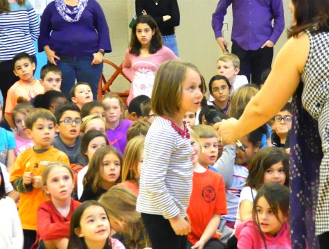 Shenea Booth, hand balancer from Cirque Dreams Holidaze, answered questions from students during her visit to Lowell Elementary School in Watertown, Mass., on Friday, Nov. 18, 2016. 
