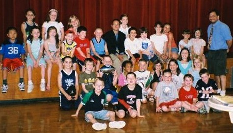Reporters from the Cunniff Kids News pose with Patriots reporter Mike Reiss of the Boston Globe (center with black jacket) following a press conference at Cunniff Elementary School on June 11, 2008.
