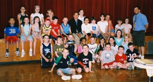 Reporters from the Cunniff Kids News pose with Patriots reporter Mike Reiss of the Boston Globe (center with black jacket) following a press conference at Cunniff Elementary School on June 11, 2008.