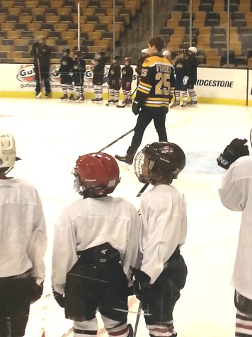 Members of the Watertown Youth Hockey program watch Bruins player Matt Fraser during a clinic at TD Garden on Nov. 19, 2014.