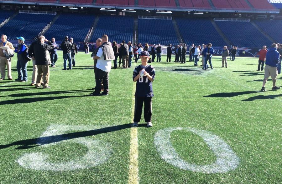 The author (above) on the field at Gillette Stadium on Oct. 12, 2014, for “Game with the Greats,” a fund-raiser put on by the New England Patriots Alumni Club. Among the former Patriots players on hand were Harold Shaw, Gino Cappelletti, Steve Grogan, Steve King, Ronnie Lippett, Patrick Pass, and Pete Brock, one of the founders of the club in 1997.