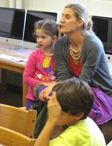 Lee Haley (in grey sweater), a parent volunteer with the Cunniff School PTO, talks with Cunniff Kids News reporters about the annual Halloween Party to be held Friday, Oct. 30, 2015.