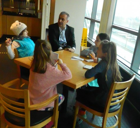 Doug Zeghibe of the Skating Club of Boston answers questions from reporters from the Cunniff Kids News on Monday, March 28 -- the first day of the 2016 World Figure Skating Championships at TD Garden in Boston. 