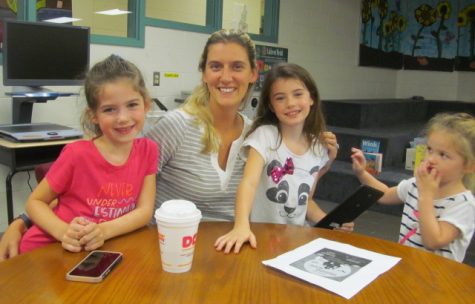 Lee Haley of the Cunniff PTO (second from left) poses after an interview in the Cunniff Kids News newsroom.