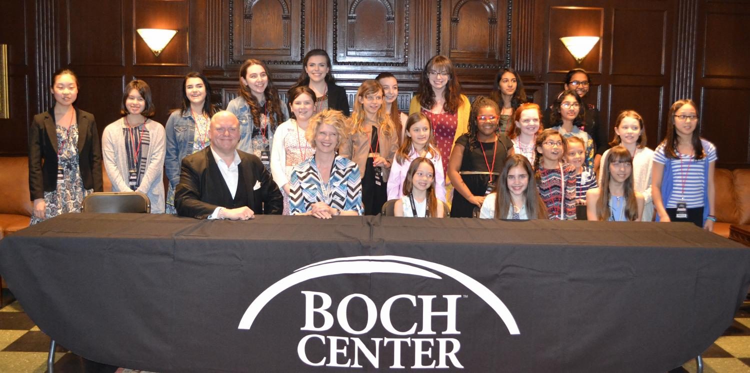 Members of the cast of Annie -- (sitting, from left) Gilgamesh Taggett, Erin Fish, Katie Wylie, Amanda Swickle, and Amanda Wylie -- pose with student reporters during a news conference in the Boch Center/Wang Theatre before their show May 10, 2017.