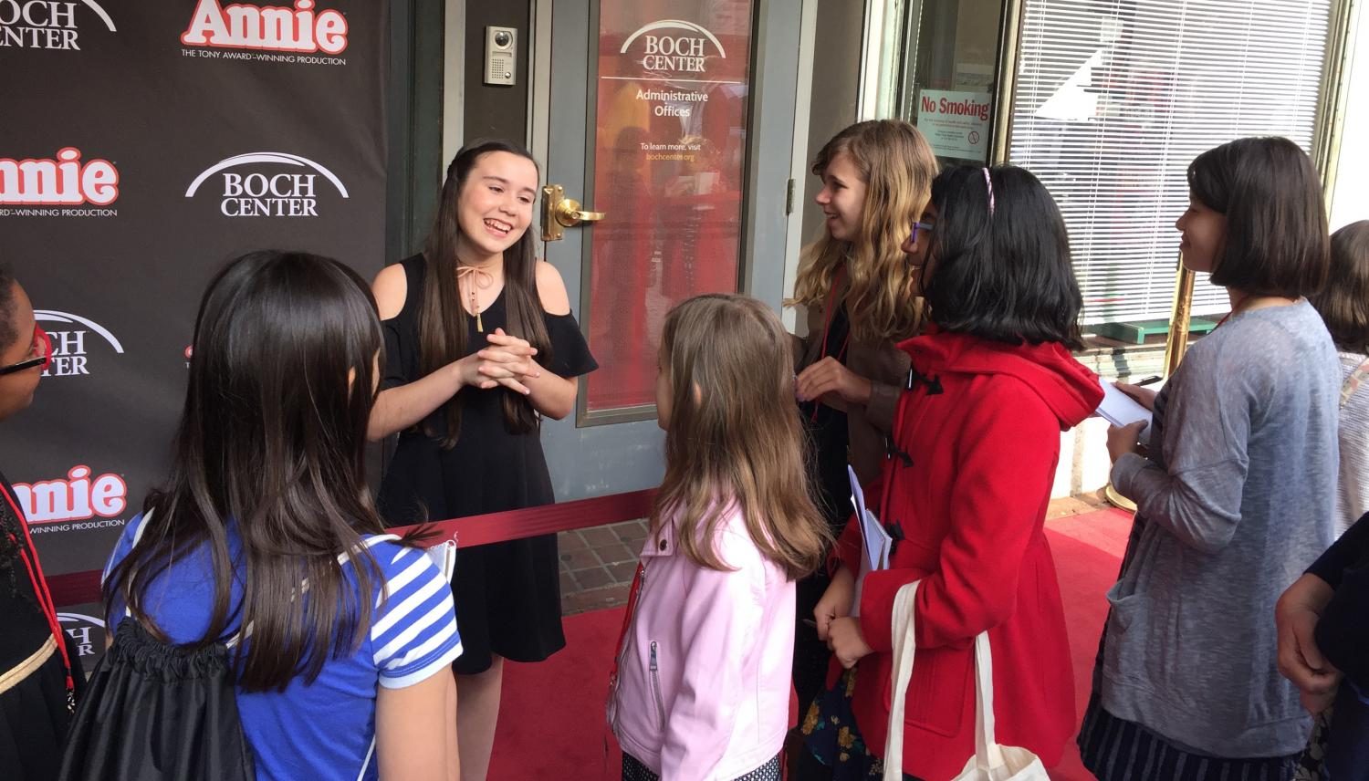 Angelina Carballo, who has the lead role in Annie, talks with reporters on the red carpet outside the Boch Center/Wang Theatre before the show May 10, 2017.