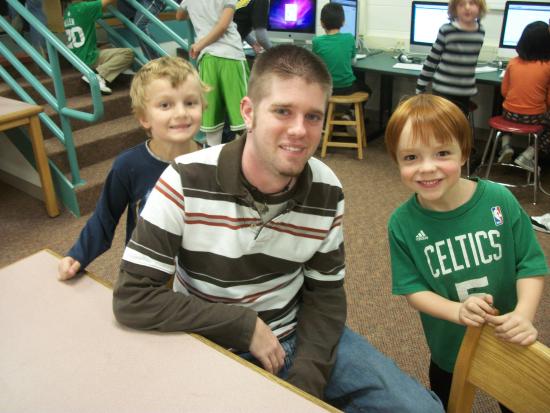 Sean McSweeny (in striped shirt) poses with reporters
in the newsroom of the Cunniff Kids News.