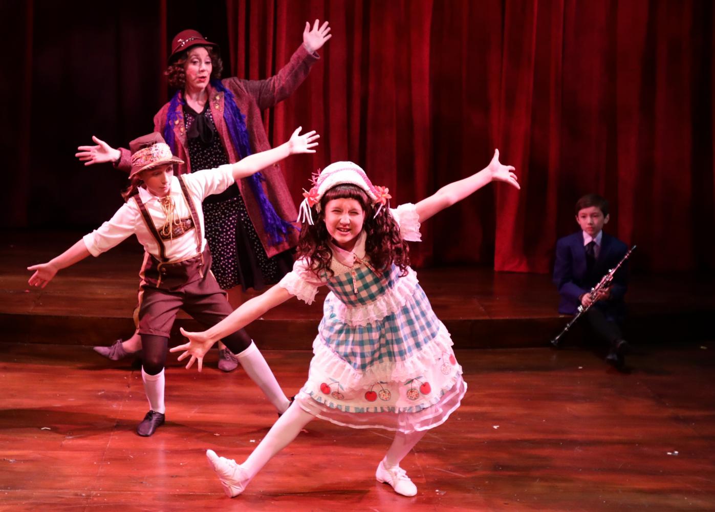 Leigh Barrett, Cate Galante, and Margot Anderson-Song (back to front) star in Lyric Stage's production of